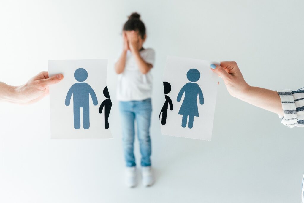Selective Focus Of Man And Woman Holding Ripped Paper With Separated Family Near Adopted African
