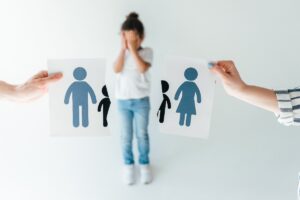 Selective Focus Of Man And Woman Holding Ripped Paper With Separated Family Near Adopted African